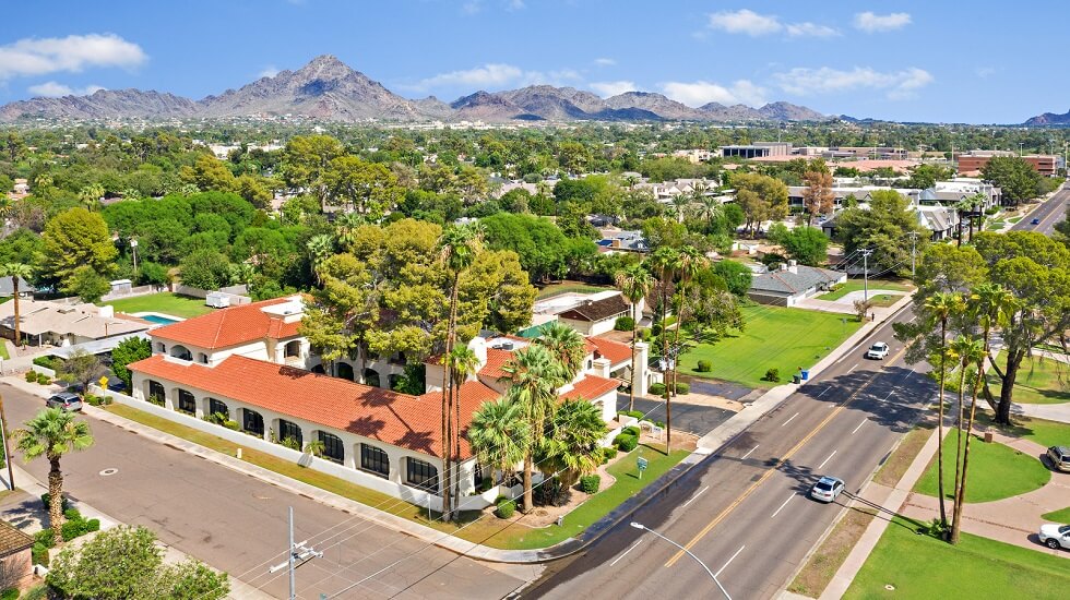 Aerial view of suburban area and mountains.
